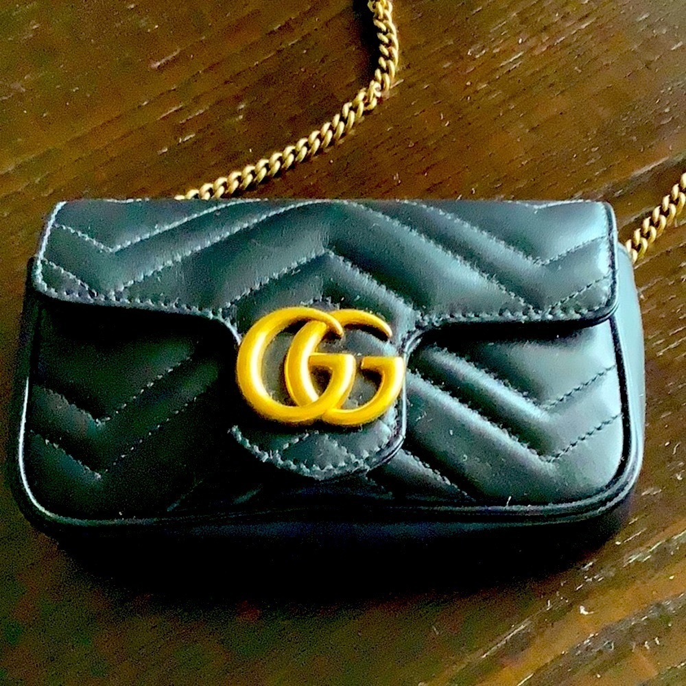 Gucci GG Marmont leather super mini bag in black & gold